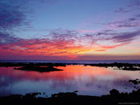 View of Sunset over the water at Kapoho on Hawaii island