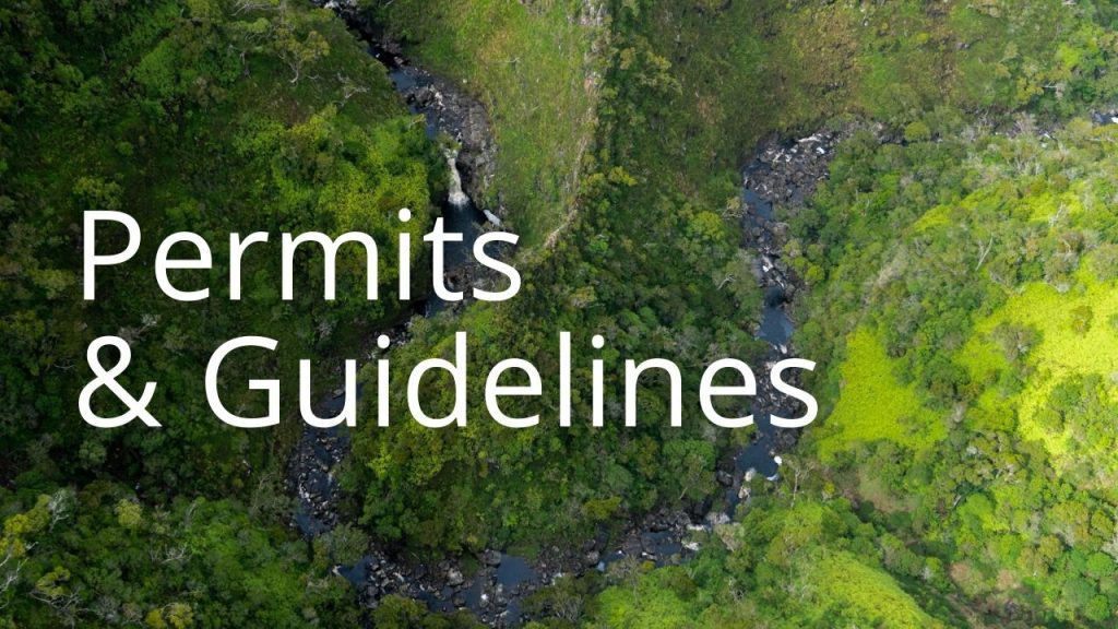 An image of a forest and stream linking to a page on permits and guidelines