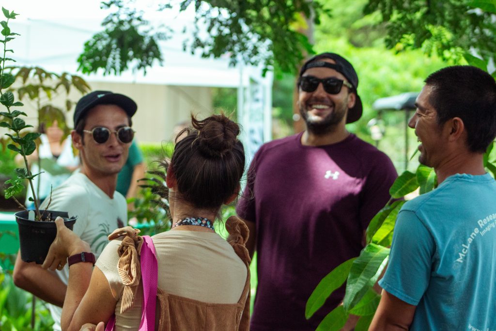 Group of 4 people laugh during Arbor Day 2022