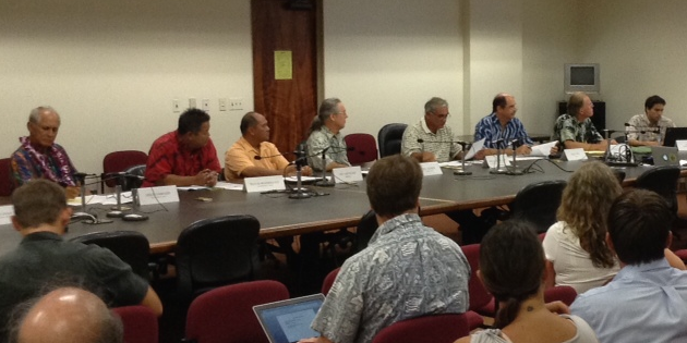 Members and legislative participants of the Hawaii Invasive Species Council review an interagency budget for invasive species projects in FY15