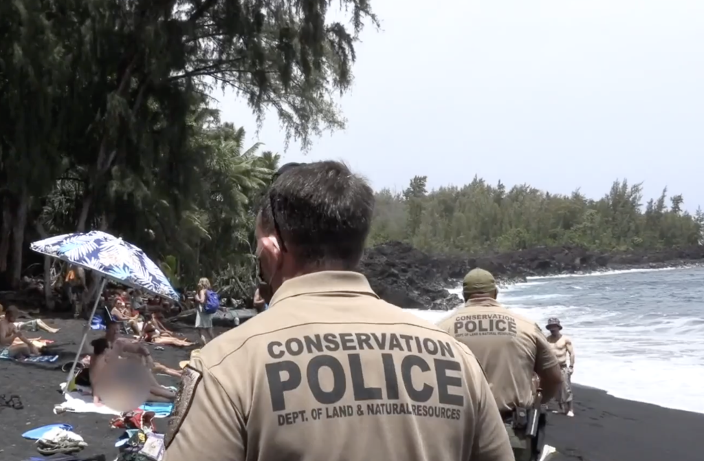 DOCARE officers patrolling a beach