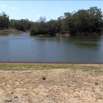 Photo from shore overlooking the water of Wahiawā Reservoir (also known as Lake Wilson), 05-12-2022.