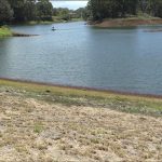 Photo from shore of a buoy floating on Wahiawā Reservoir (also known as Lake Wilson), 05-12-2022.
