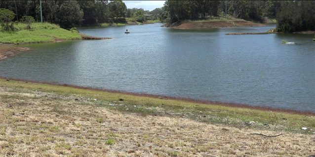 Photo from shore of a buoy floating on Wahiawā Reservoir (also known as Lake Wilson), 05-12-2022.