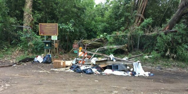 Photo of trash and debris dumped in front of public hunting area