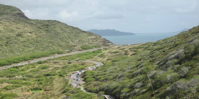 View from Makapuʻu Point Lighthouse Trail looking down at the trail to the parking area and the waters of Waimanalo, Oʻahu.