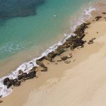 Aerial image of World War II-era structures along the southwestern shoreline of Sand Island State Recreation Area on Oʻahu, taken by drone operator in 2021.