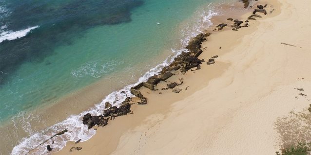 Aerial image of World War II-era structures along the southwestern shoreline of Sand Island State Recreation Area on Oʻahu, taken by drone operator in 2021.